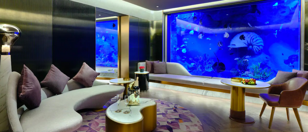 underwater hotel room with view of underwater activity