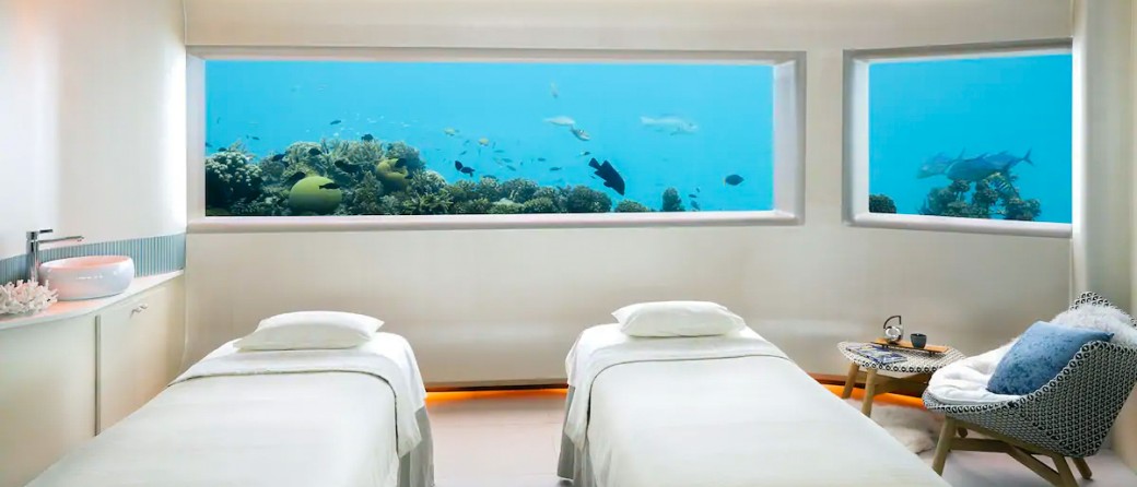 underwater hotel room with view of underwater activity