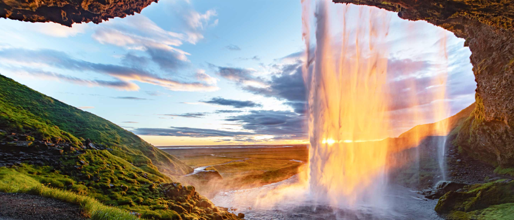 Picture of a waterfall taken from behind the waterfall