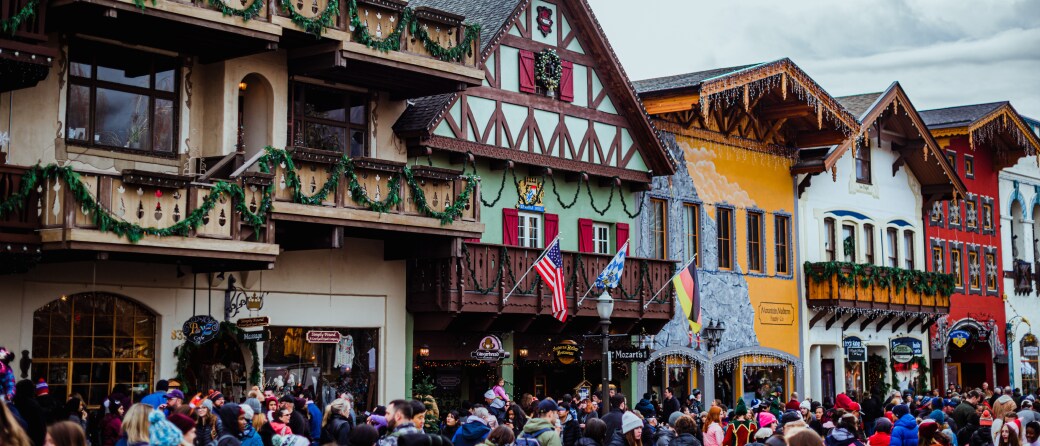 Bavarian-styled street in downtown Leavenworth, Washington. The street is filled with people during a festival.
