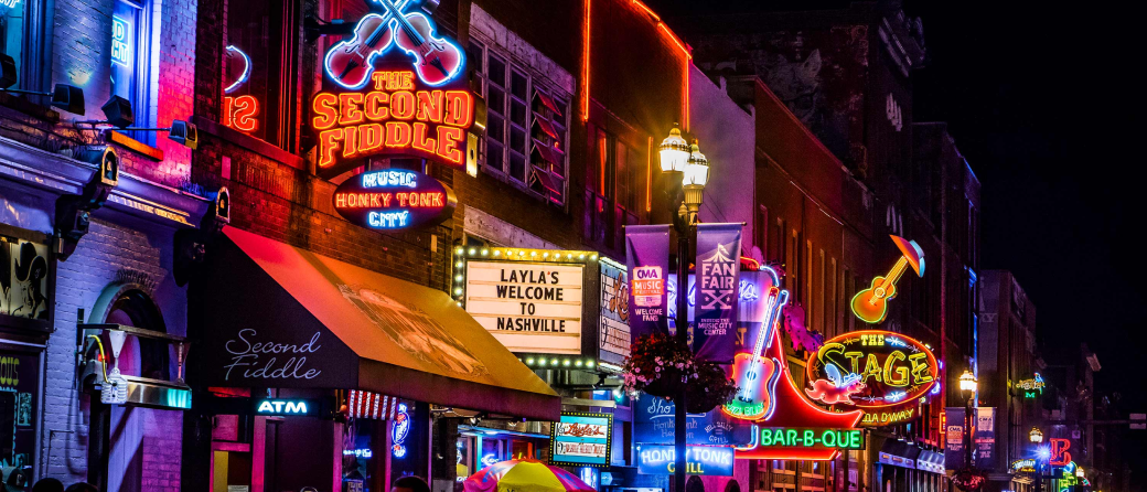 Street view of Broadway at night, in downtown Nashville, Tennessee.