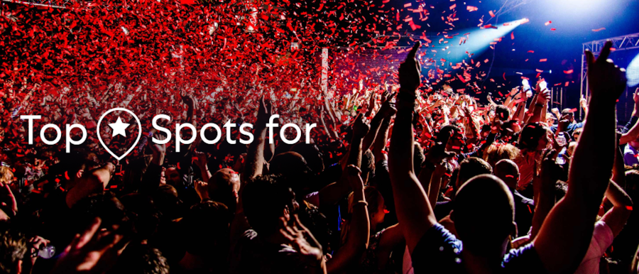 View from the crowd of a rock concert. A superimposed title reads: Top spots for.