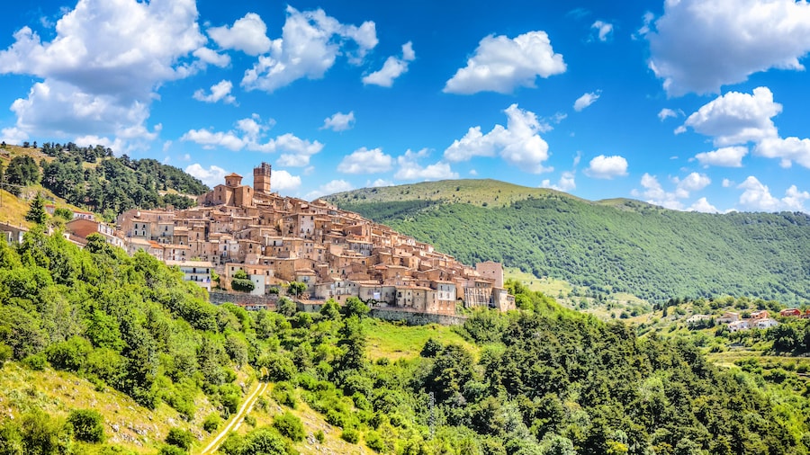 italian medieval town in the hills surrounded by green countryside