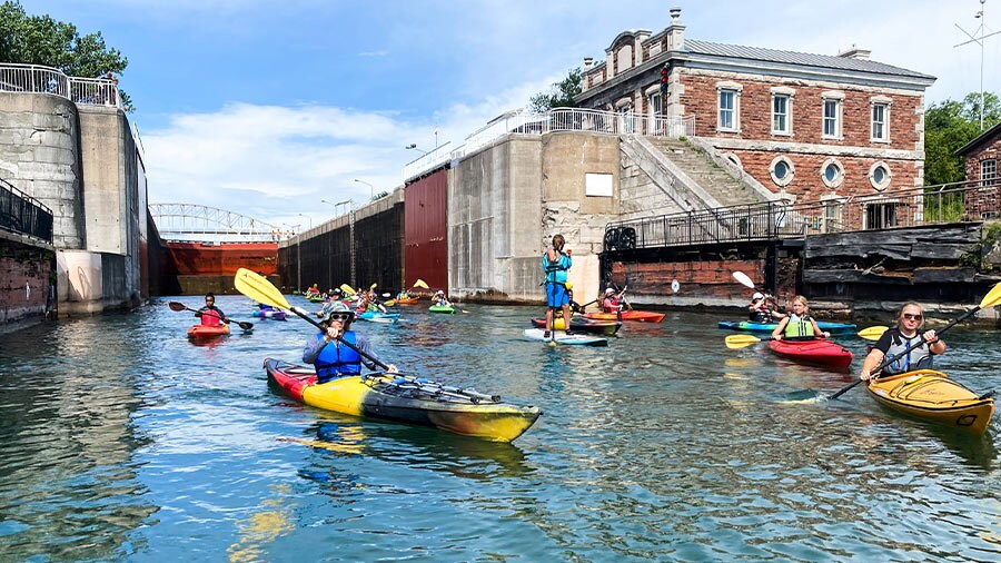 Kayakers paddling through the Soo Locks in Sault Ste. Marie, Michigan