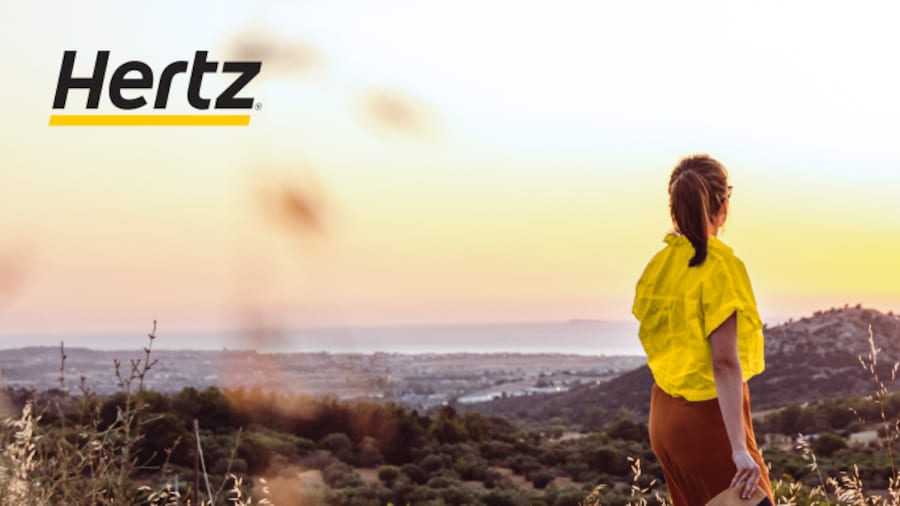 A woman looks at the sunset.