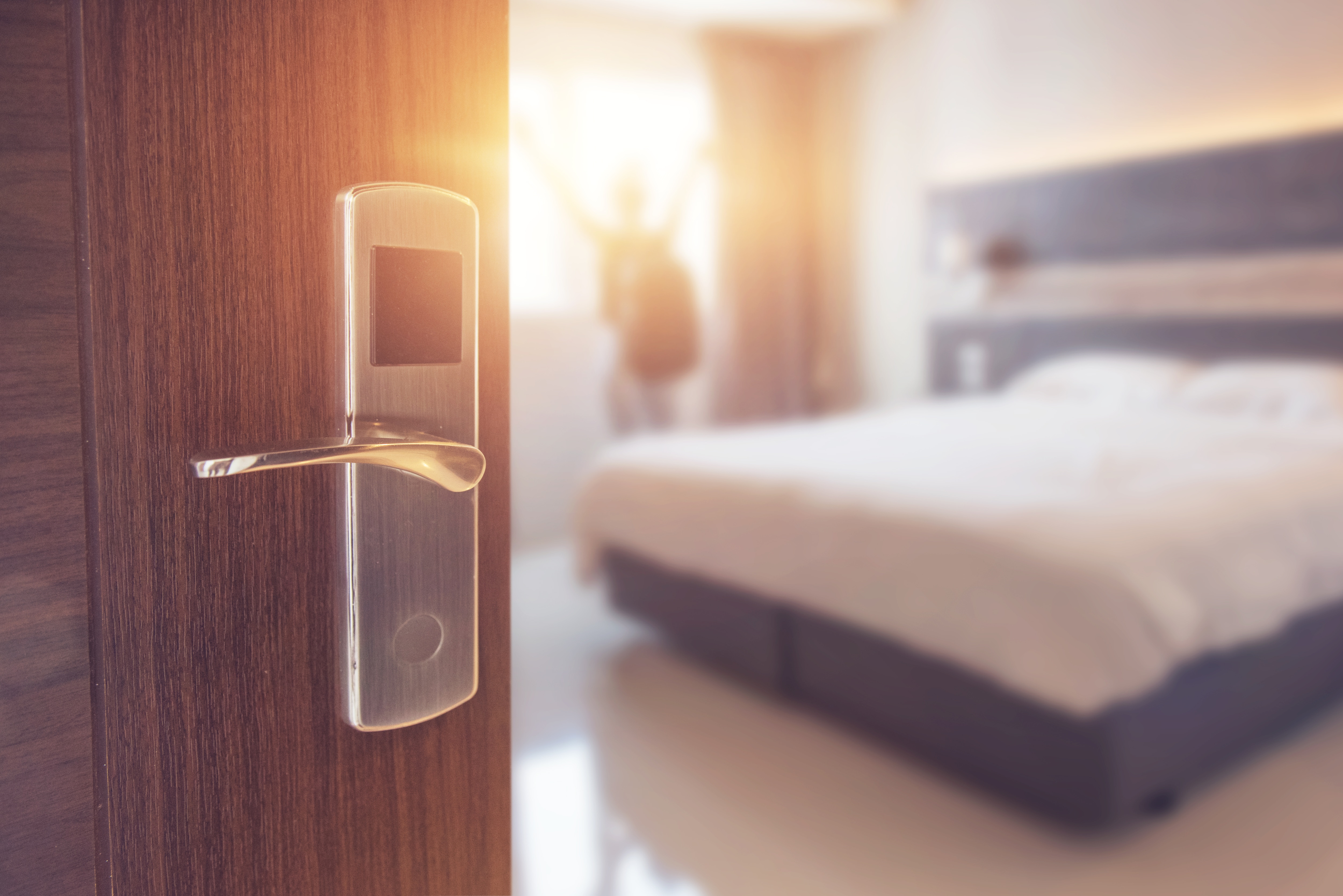 Opened-door-of-hotel-room