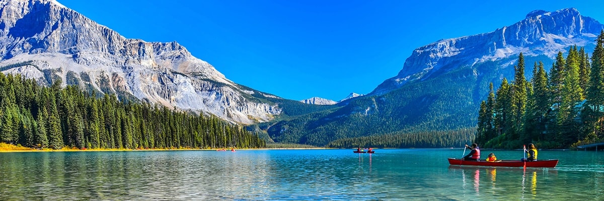 A group in canoes enjoying scenic Emerald Lake in British Columbia, Canada.