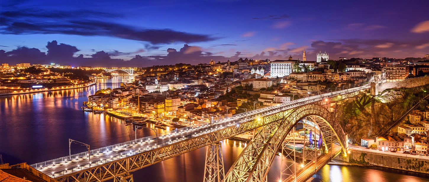 A bridge over a river with lights