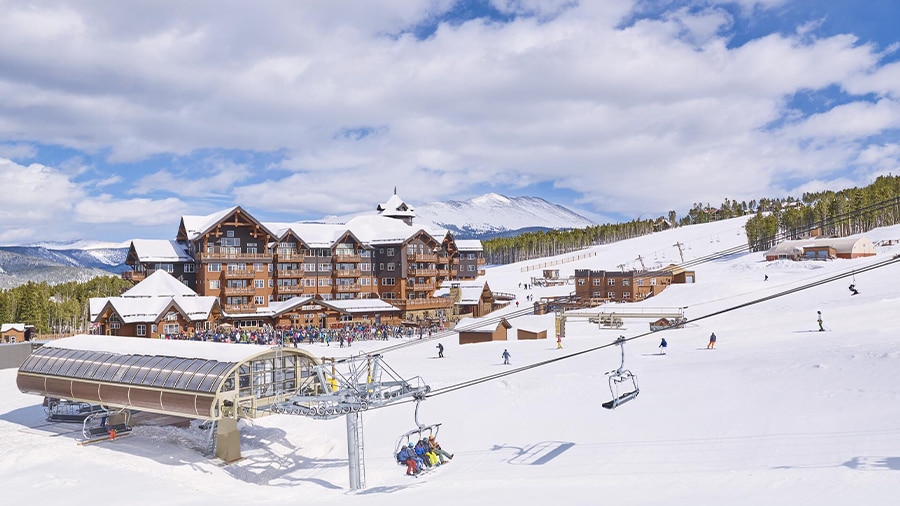 A ski resort with a ski lift and people
