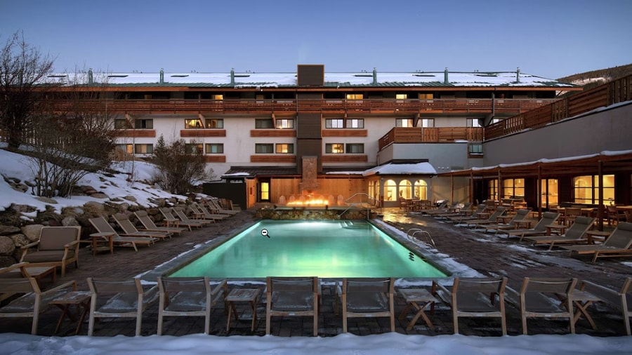 A pool in front of a building
