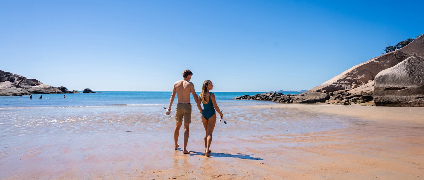 A couple walking on a beach