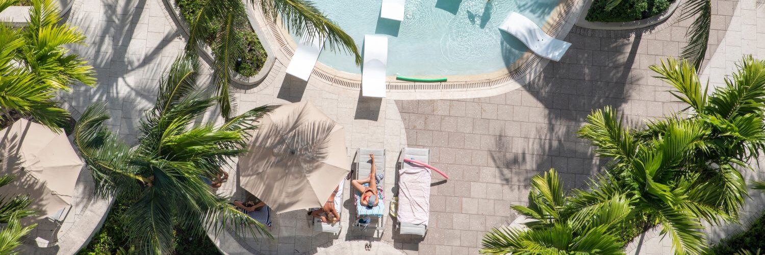 Luxury hotel pool and palm trees