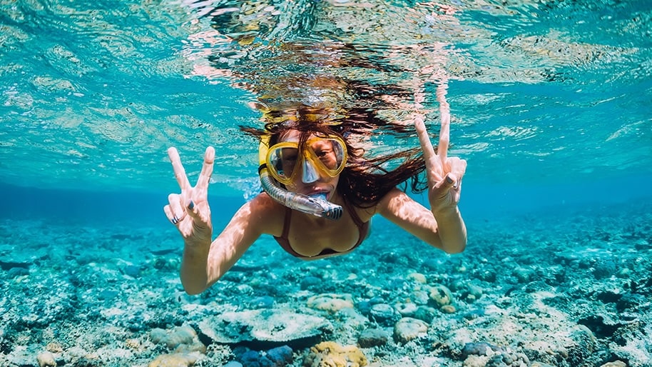 A woman snorkeling in Hawaii.